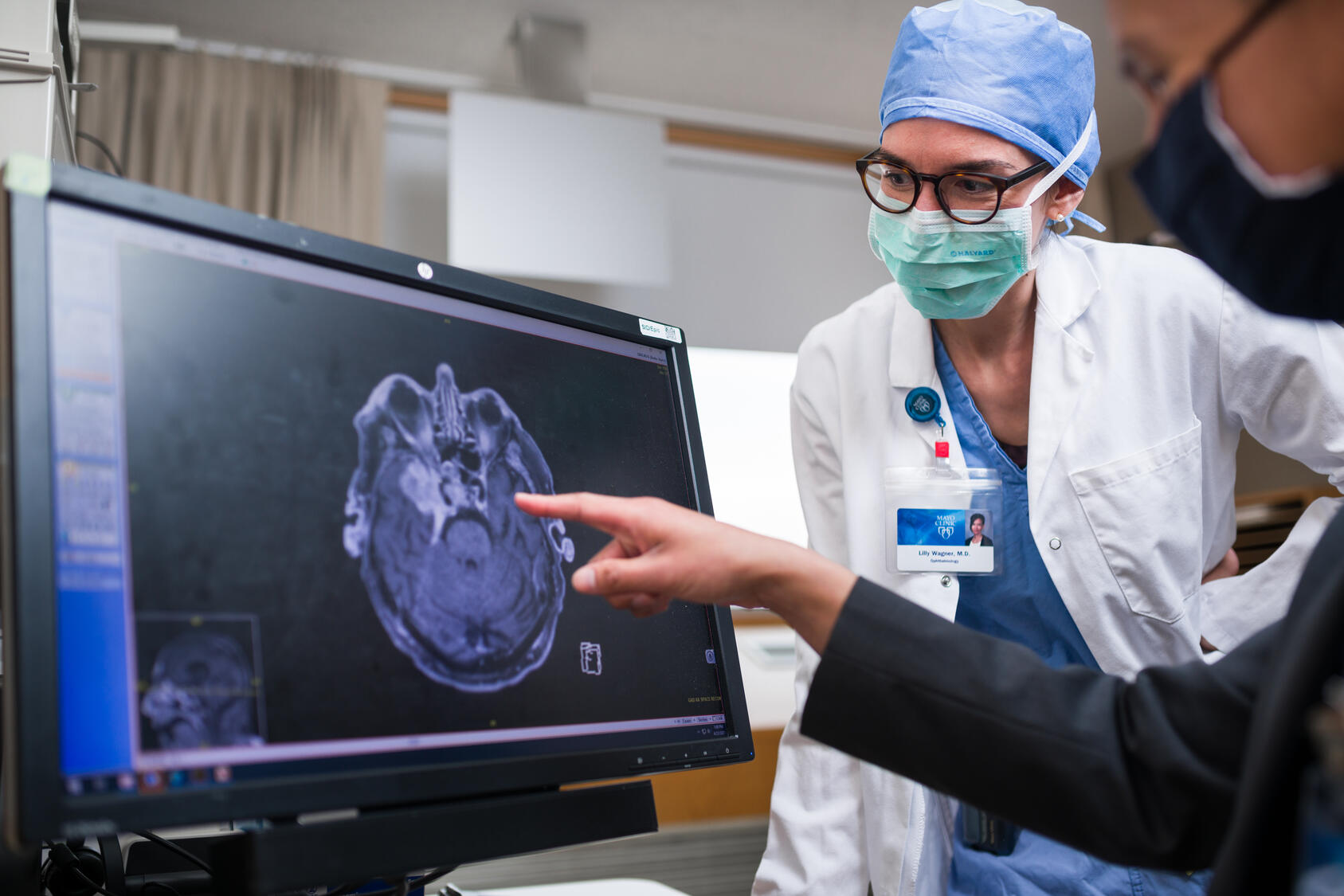 Patient using eye drops
